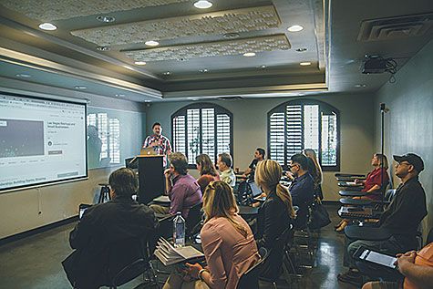 Students in a classroom, listening to a lecture