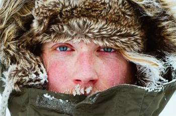 Person in winter clothes with a red face